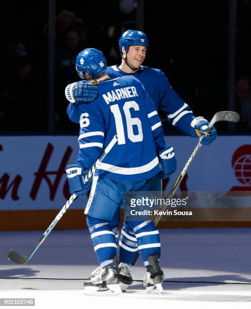 Matt Martin of the Toronto Maple Leafs gives Mitchell Marner a hug after defeating the San Jose Sharks at the Air Canada Centre on January 4, 2018 in...