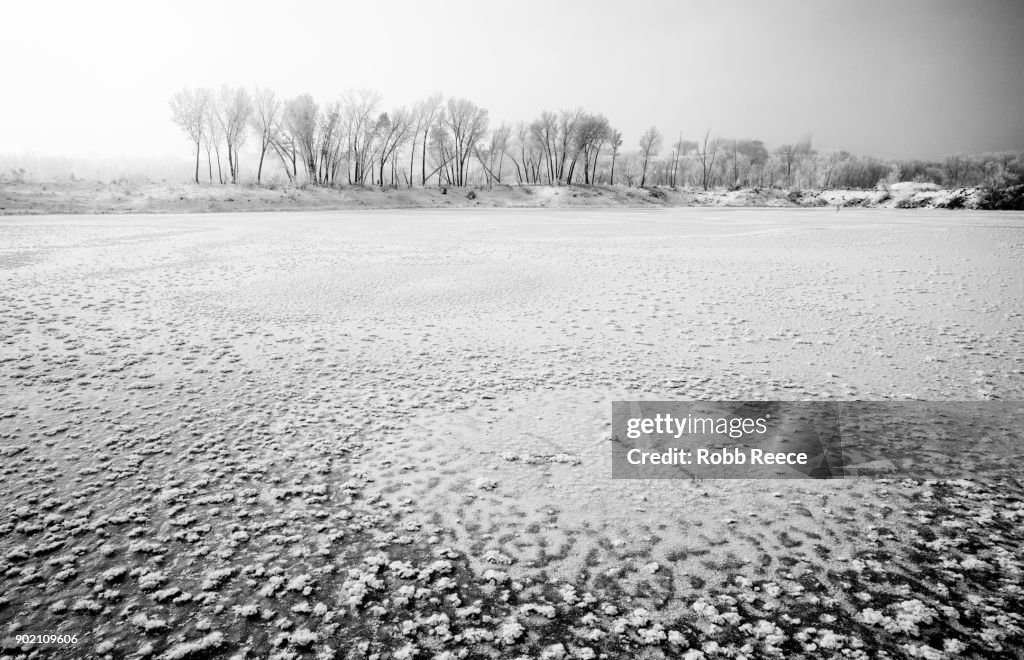 White Landscapes - Frozen lake with ice patterns in winter.