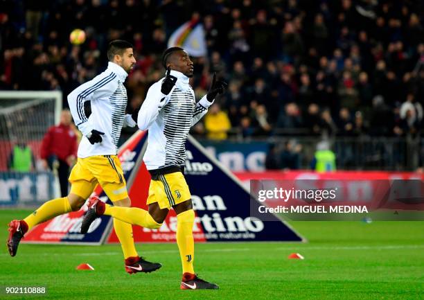 Juventus' German midfielder Sami Khedira and Juventus' French midfielder Blaise Matuidi react as they enter the pitch prior to the Italian Serie A...