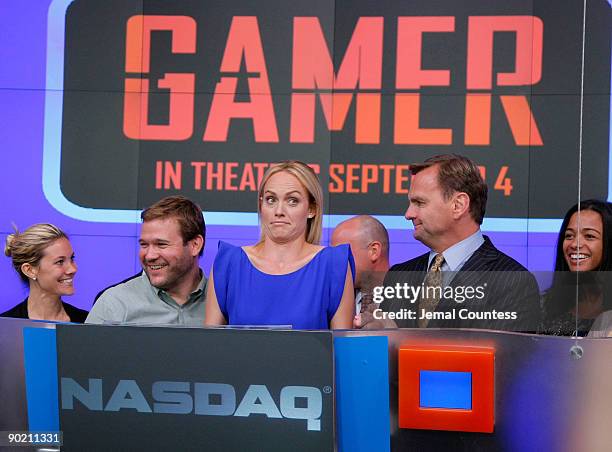 Actress Amber Vallette and Bruce Aust, Executive VP of NASDAQ are joined by guest at the Nasdaq MarketSite as Amber rings the closing bell at NASDAQ...