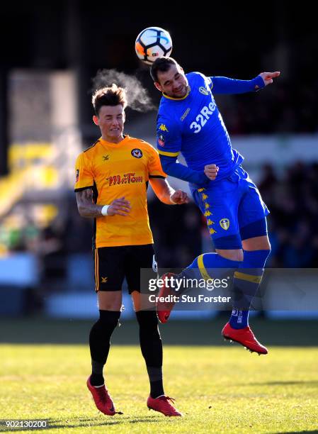 Ben White of Newport County and Pierre-Michel Lasogga of Leeds United in action during The Emirates FA Cup Third Round match between Newport County...