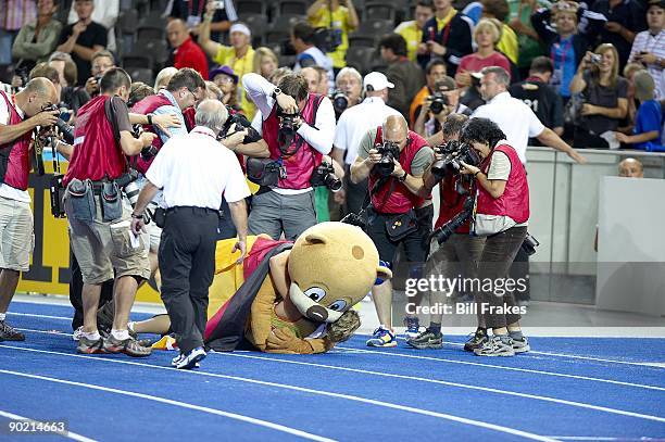 12th IAAF World Championships: Germany Steffi Nerius victorious, hugging mascot Berlino after winning Women's Javelin Final gold medal at...