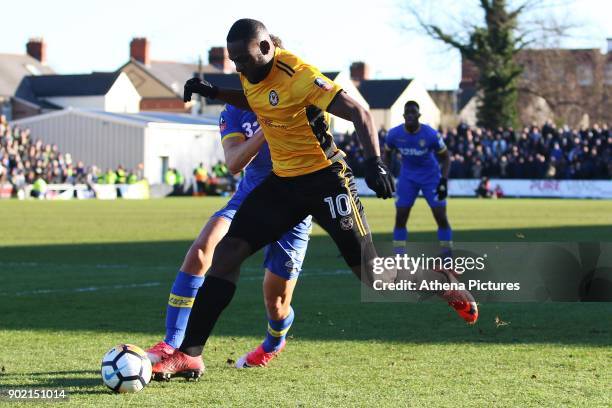 Frank Nouble of Newport County is tackled by Kalvin Phillips of Leeds United during the Fly Emirates FA Cup Third Round match between Newport County...