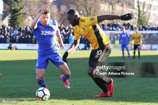 Frank Nouble of Newport County is marked by Kalvin Phillips of Leeds United during the Fly Emirates FA Cup Third Round match between Newport County...