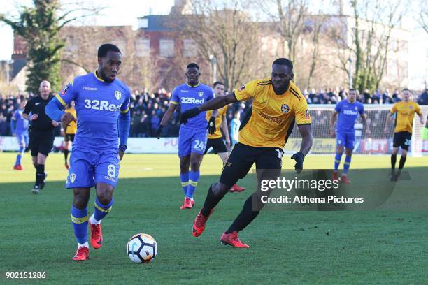 Vurnon Anita of Leeds United is challenged by Frank Nouble of Newport County during the Fly Emirates FA Cup Third Round match between Newport County...