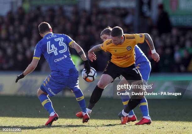 Newport County's Scot Bennett and Leeds United's Mateusz Klich battle for the ball during the Emirates FA Cup, Third Round match at Rodney Parade,...