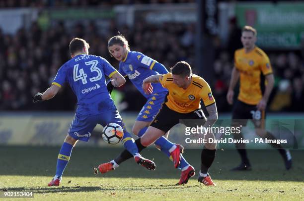 Newport County's Scot Bennett and Leeds United's Mateusz Klich battle for the ball during the Emirates FA Cup, Third Round match at Rodney Parade,...