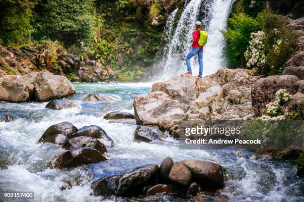 a woman at tawhai falls, tongariro national park - waikato region stock pictures, royalty-free photos & images