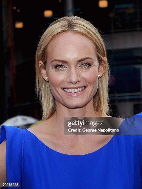 Amber Valletta rings the closing bell at the NASDAQ MarketSite on August 31, 2009 in New York City.