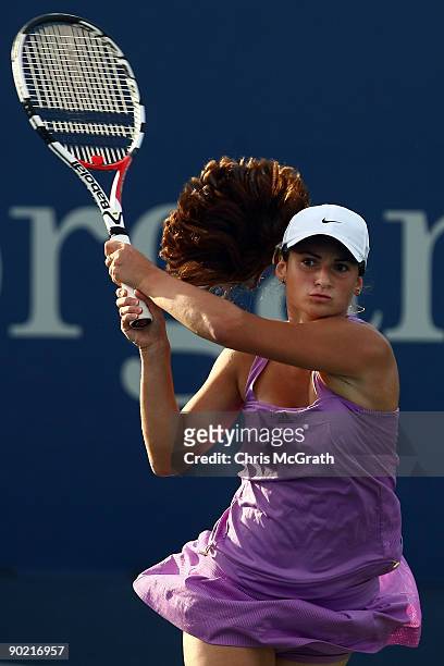 Vesna Manasieva of Russia returns a shot against Timea Bacsinszky of Switzerland during day one of the 2009 U.S. Open at the USTA Billie Jean King...