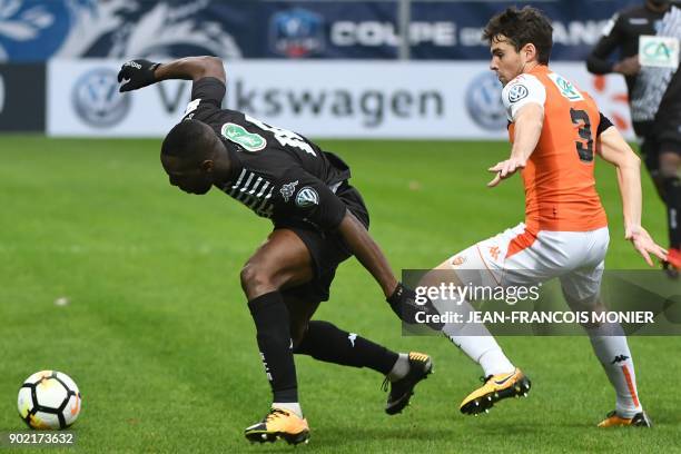 Angers' French forward Gilles Sunu vies with Lorient's French defender Vincent Le Goff during the French Cup football match match between Angers and...