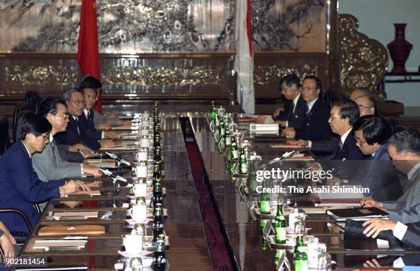 Japanese Prime Minister Toshiki Kaifu and Chinese Premier Li Peng talk during their meeting at the Great Hall of the People on August 10, 1991 in...