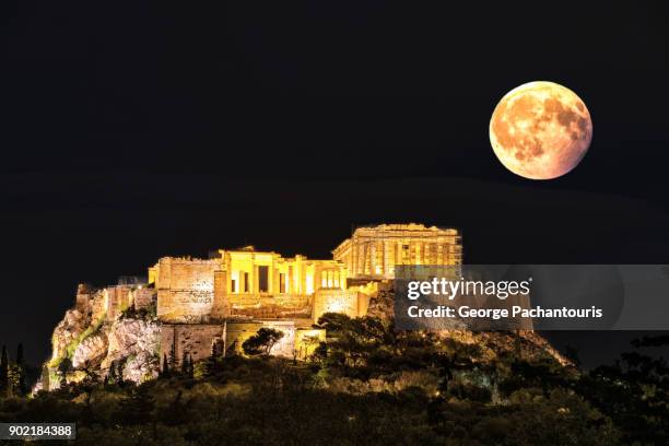 full moon and the acropolis in athens, greece - supermoon stock pictures, royalty-free photos & images