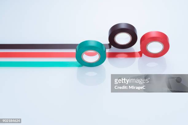 colorful duct tapes on white glass - sticky foto e immagini stock