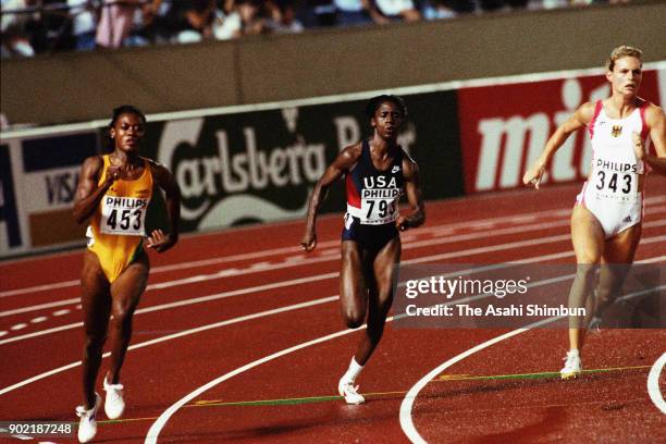 Merlene Ottey of Jamaica, Gwen Torrence of United States and Katrin Krabbe of Germany compete in the Women's 200m final during day eight of the World...