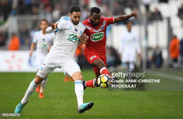 Marseille's French defender Adil Rami vies for the ball with Valenciennes's midfielder Lenny Nangis during the French Cup football match between...
