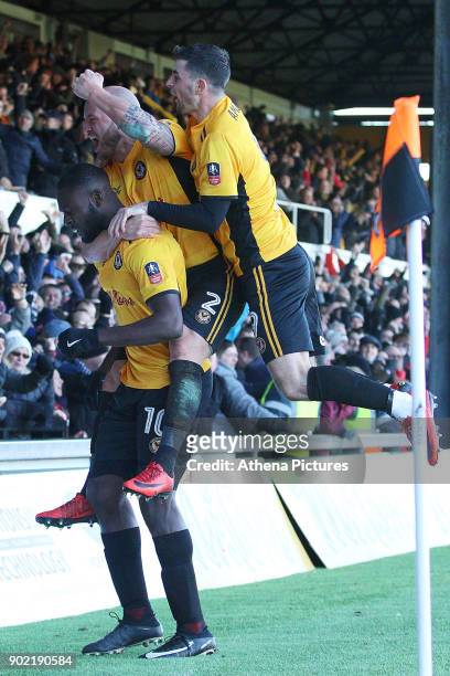 David Pipe and Padraig Amond join Frank Nouble of Newport County as he celebrates scoring his sides first goal of the match to equalise with Leeds...