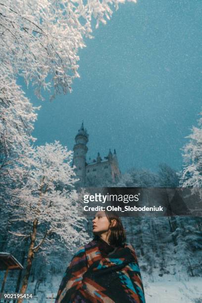 woman  near  neuschwanstein castle in germany - neuschwanstein winter stock pictures, royalty-free photos & images