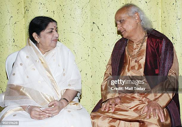 Lata Mangeshkar and Pandit Jasraj attend the launch of T-Series' new album Hanuman Chalisa by Lata Mangeshkar on August 27, 2009 in Mumbai, India.