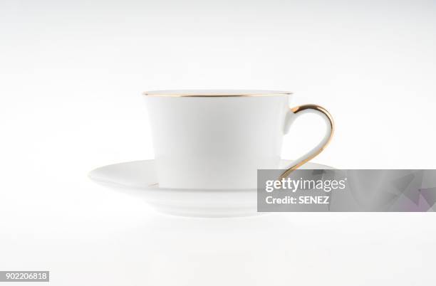 cappuccino in a white mug on a saucer, white background - tea cup photos et images de collection
