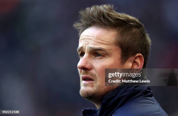 Wimbledon manager, Neal Ardley, looks on prior to The Emirates FA Cup Third Round match between Tottenham Hotspur and AFC Wimbledon at Wembley...