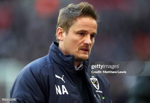 Wimbledon manager, Neal Ardley, looks on prior to The Emirates FA Cup Third Round match between Tottenham Hotspur and AFC Wimbledon at Wembley...