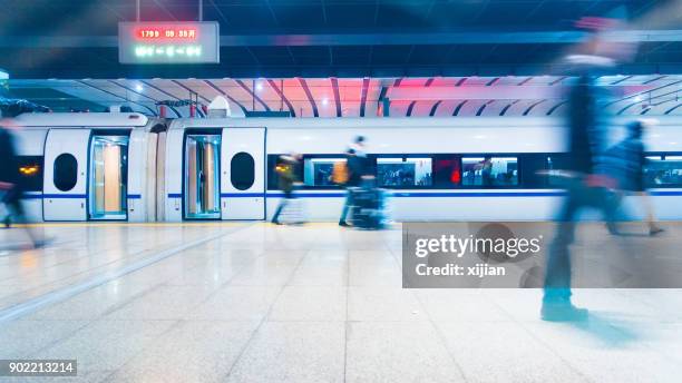 people walking in train station - railway station china stock pictures, royalty-free photos & images