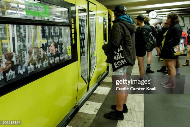 Participants of the No Pants Subway Ride By Odlo wait for a commuter train on January 7, 2018 in Berlin, Germany. The annual event, in which...