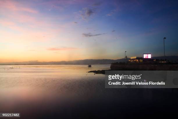 sunset at cordova, mactan, cebu, philippines - joemill flordelis stock pictures, royalty-free photos & images