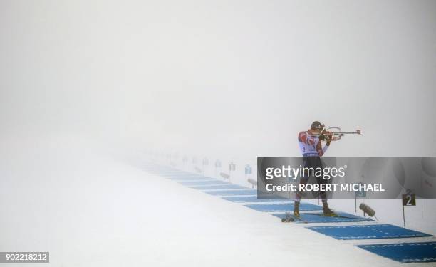Tarjei Boe of team Norway competes at the shooting range during heavy fog at the men's 4 x 7,5 km relay event of the IBU Biathlon World Cup in...