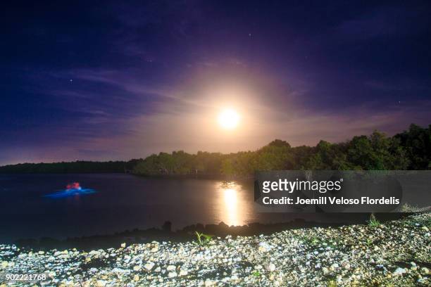 supermoon as seen in cordova, mactan, cebu, philippines (december 4, 2017) - joemill flordelis stock pictures, royalty-free photos & images