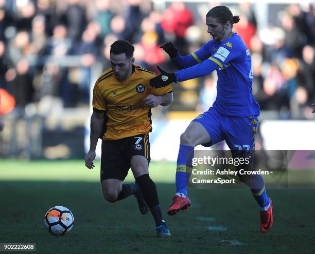 Newport County's Robbie Willmott vies for possession with Leeds United's Pawel Cibicki during the Emirates FA Cup Third Round match between Newport...