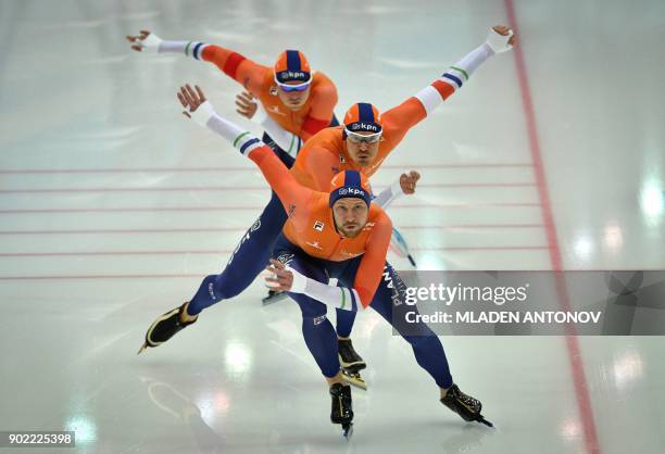 Dutch team members Michel Mulder, Hein Otterspeer and Koen Verweij skate during the men's team sprint men of the European Speed Skating Championship...