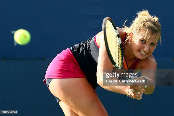 Timea Bacsinszky of Switzerland returns a shot against Vesna Manasieva of Russia during day one of the 2009 U.S. Open at the USTA Billie Jean King...