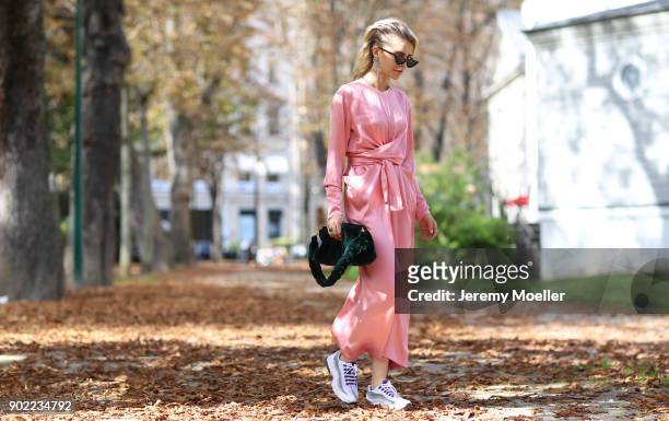 Caro Daur wearing a Miu Miu bag during the Paris Fashion Week on September 29, 2017 in Paris .