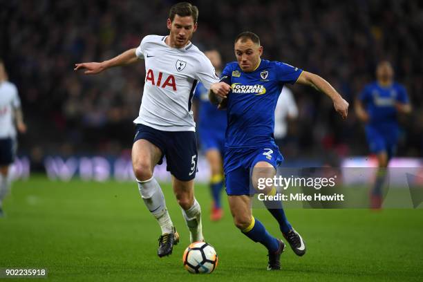 Jan Vertonghen of Tottenham Hotspur and Barry Fuller of AFC Wimbledon battle for the ball during The Emirates FA Cup Third Round match between...