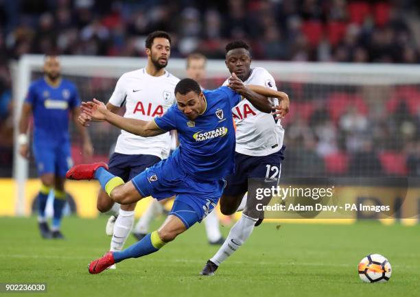 Wimbledon's Darius Charles and Tottenham Hotspur's Victor Wanyama battle for the ball during the Emirates FA Cup, Third Round match at Wembley...