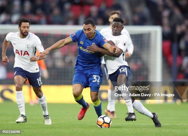 Wimbledon's Darius Charles and Tottenham Hotspur's Victor Wanyama battle for the ball during the Emirates FA Cup, Third Round match at Wembley...
