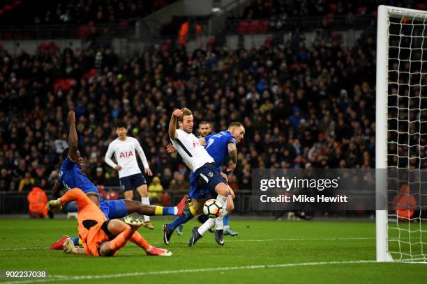 Harry Kane of Tottenham Hotspur scores the opening goal during The Emirates FA Cup Third Round match between Tottenham Hotspur and AFC Wimbledon at...