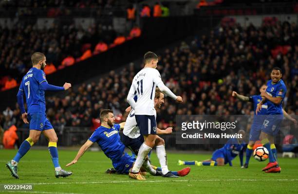 Harry Kane of Tottenham Hotspur scores his side's second goal during The Emirates FA Cup Third Round match between Tottenham Hotspur and AFC...