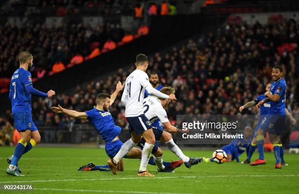 Harry Kane of Tottenham Hotspur scores the second Tottenham goal during The Emirates FA Cup Third Round match between Tottenham Hotspur and AFC...