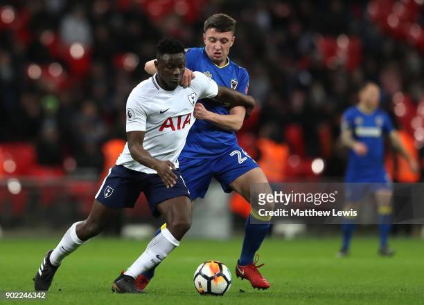 Victor Wanyama of Tottenham Hotspur and Anthony Hartigan of AFC Wimbledon battle for the ball during The Emirates FA Cup Third Round match between...