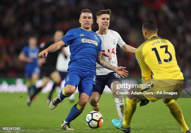 Wimbledon's Cody McDonald and Tottenham Hotspur's Juan Foyth battle for the ball during the Emirates FA Cup, Third Round match at Wembley Stadium,...