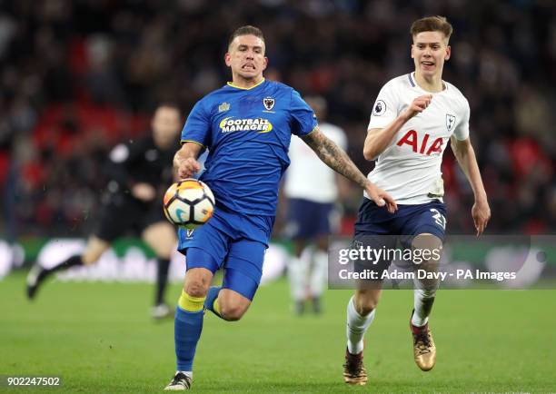 Wimbledon's Cody McDonald and Tottenham Hotspur's Juan Foyth battle for the ball during the Emirates FA Cup, Third Round match at Wembley Stadium,...