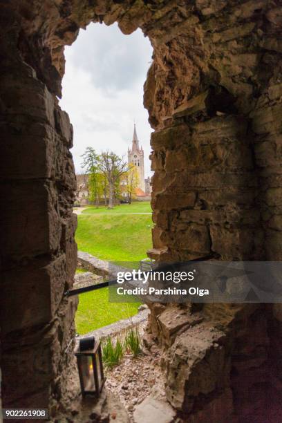 view from castle ruins to st. joan church in cesis, latvia - cesis latvia stock pictures, royalty-free photos & images