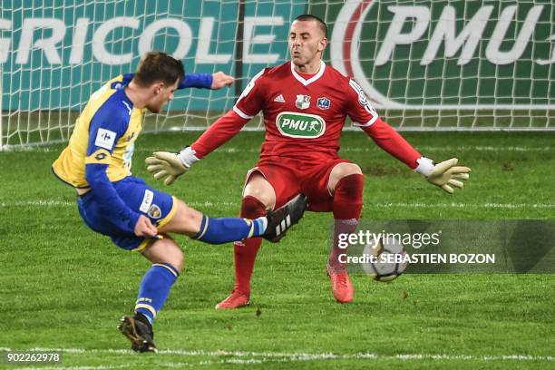 Sochaux French forward Thomas Robinet scores a goal despite of Amiens' French goalkeeper Jean-Christophe Bouet during the French Cup football match...