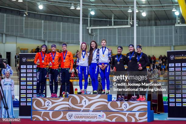 Team Netherlands, team Russia and team Norway pose in the Ladies Team Sprint medal ceremony during day three of the European Speed Skating...