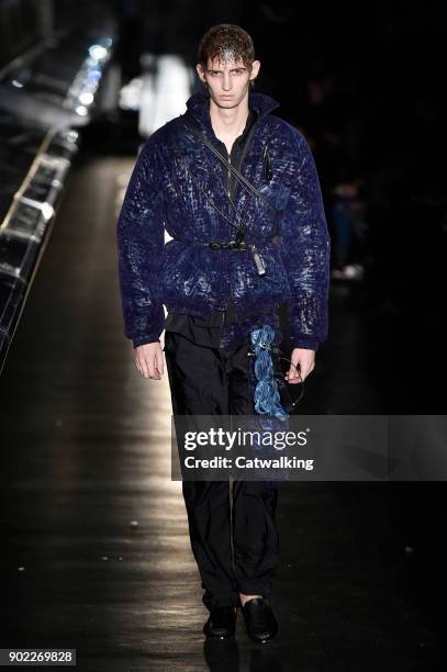 Model walks the runway at the Cottweiler Autumn Winter 2018 fashion show during London Menswear Fashion Week on January 6, 2018 in London, United...