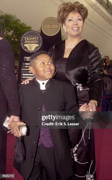 Actor Emmanuel Lewis and an unidentified guest arrive at the 10th Annual Trumpet Awards sponsored by Turner Broadcasting January 7, 2002 in Atlanta,...