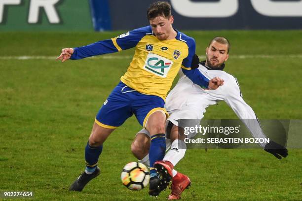 Sochaux French forward Thomas Robinet vies with Amiens' Moroccan defender Oualid El-Hajjam during the French Cup football match between Sochaux vs...